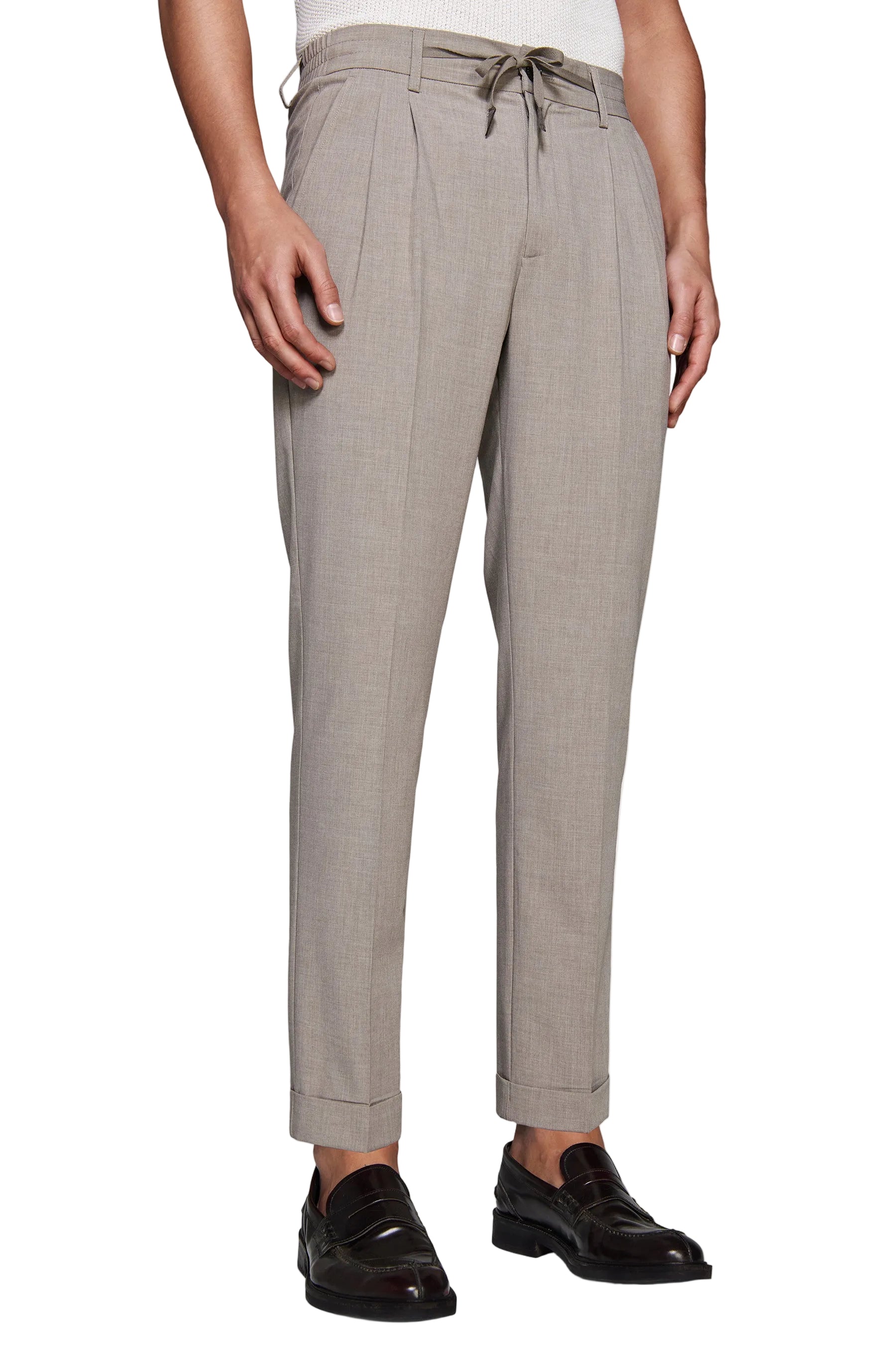 Taupe pleated men's trousers with a drawstring waist, belt loops, side pockets, and cuffed hems.