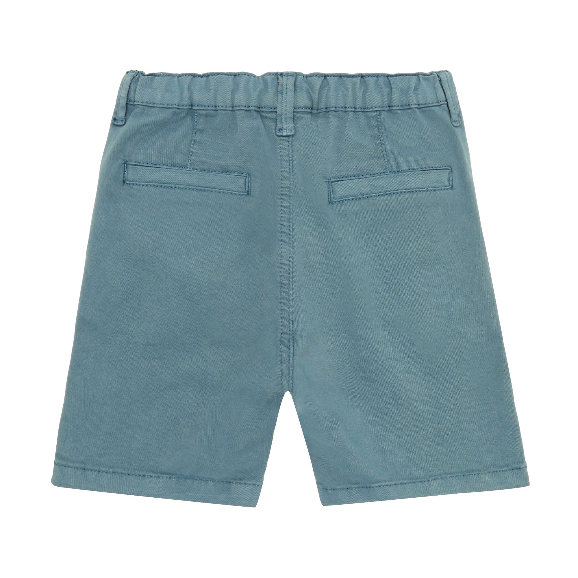 Dusty blue woven shorts, back view. Features an elasticated waistband, belt loops, and two back welt pockets.