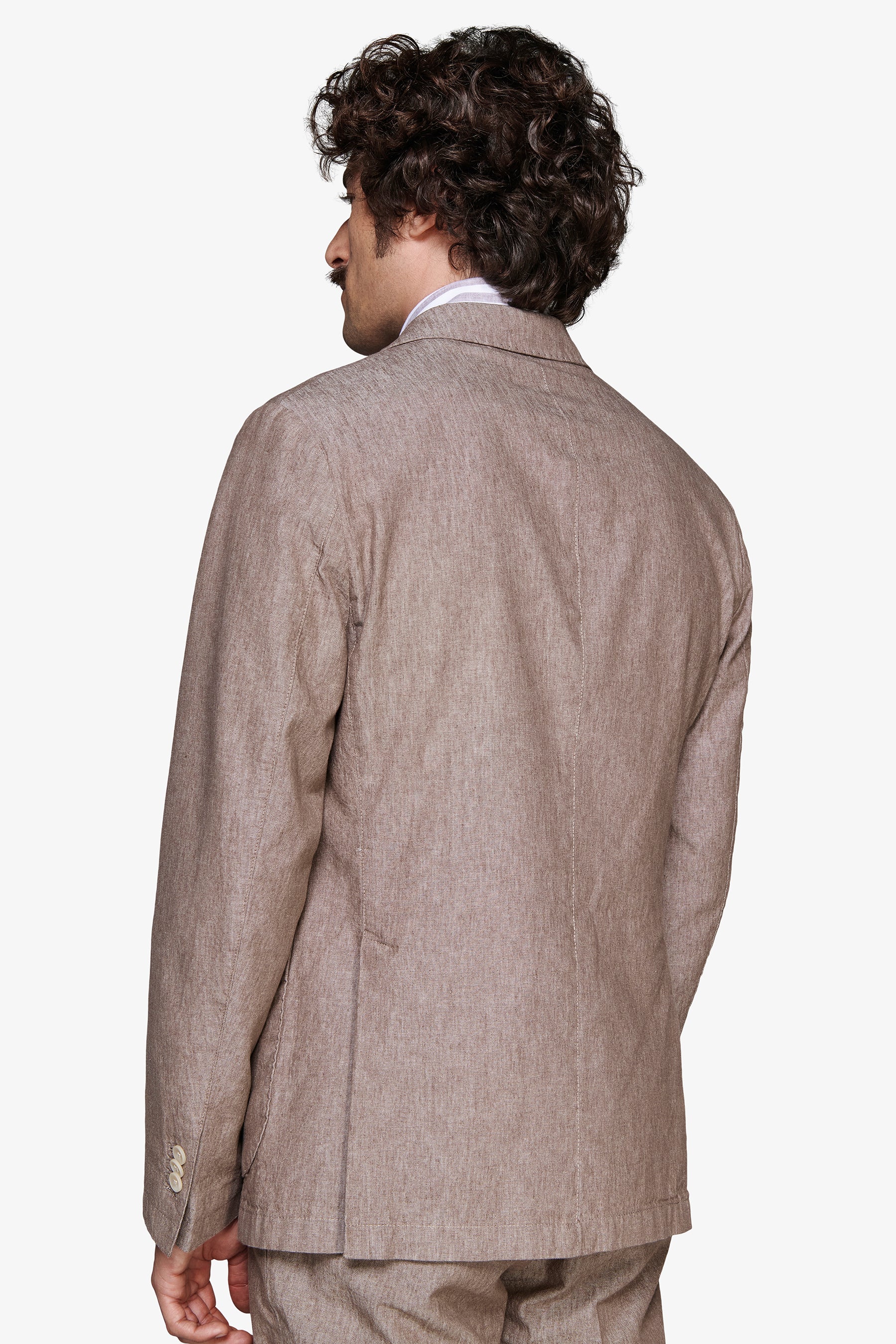 Tortora modular jacket with a textured fabric, single back vent, and three light buttons on the left sleeve cuff.