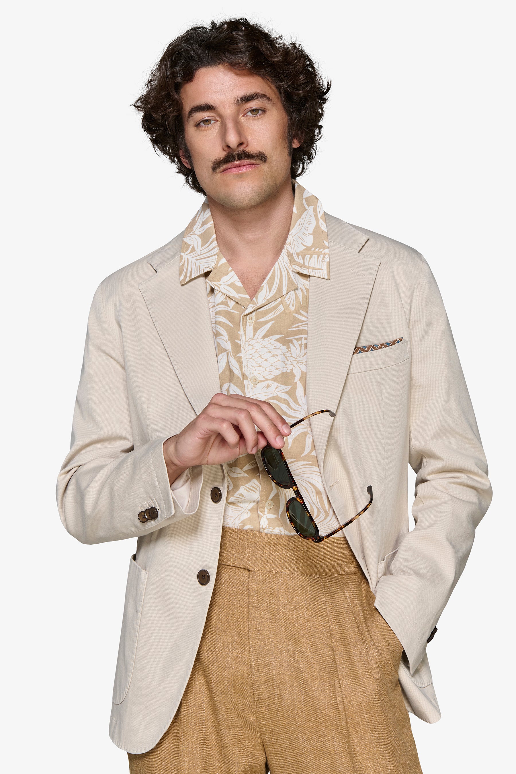 Light beige single-breasted blazer with notched lapels, two dark brown buttons, and a front patch pocket.