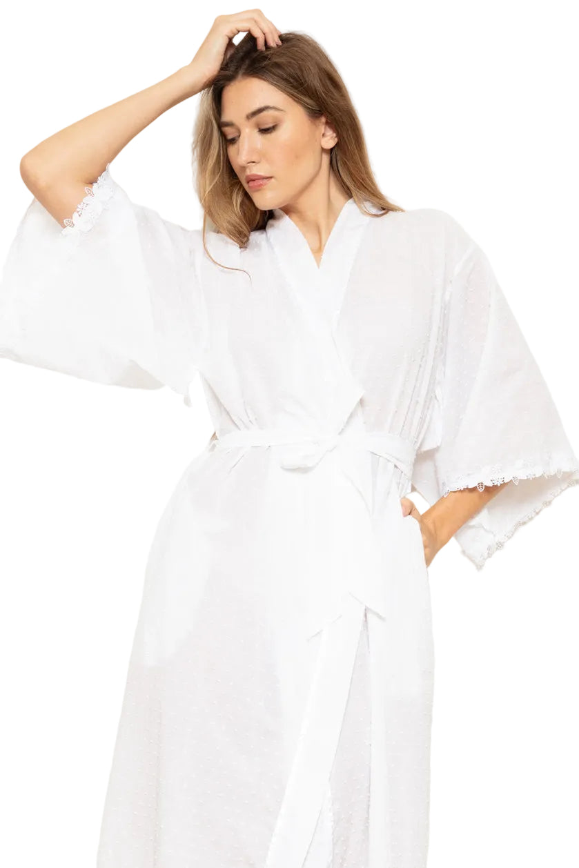 White supervoile Swiss dot kimono wrapover with wide sleeves, self-tie waist, and lace trim on sleeve edges.