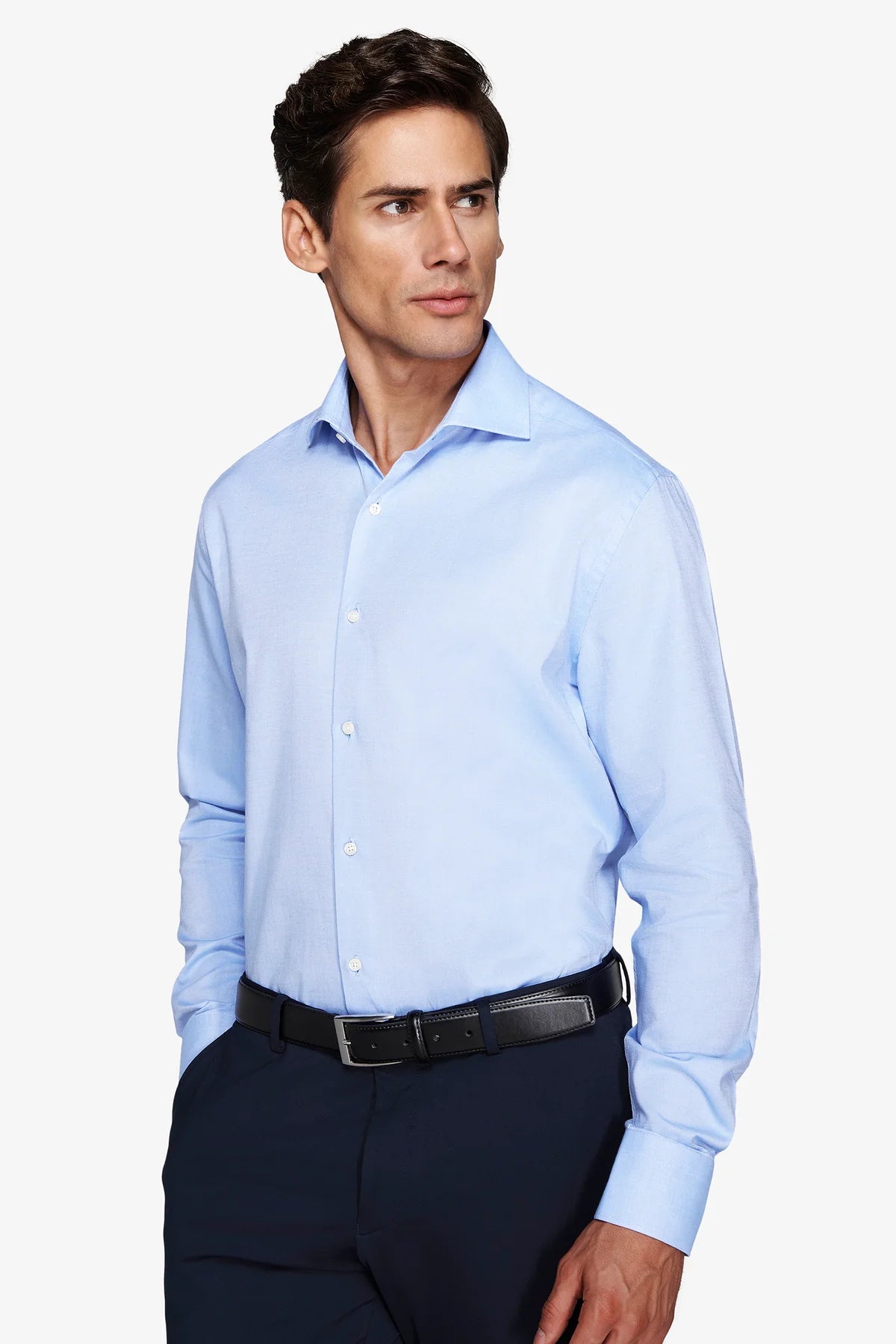 Light blue long-sleeved tailored shirt with a spread collar, white buttons, and buttoned cuffs.