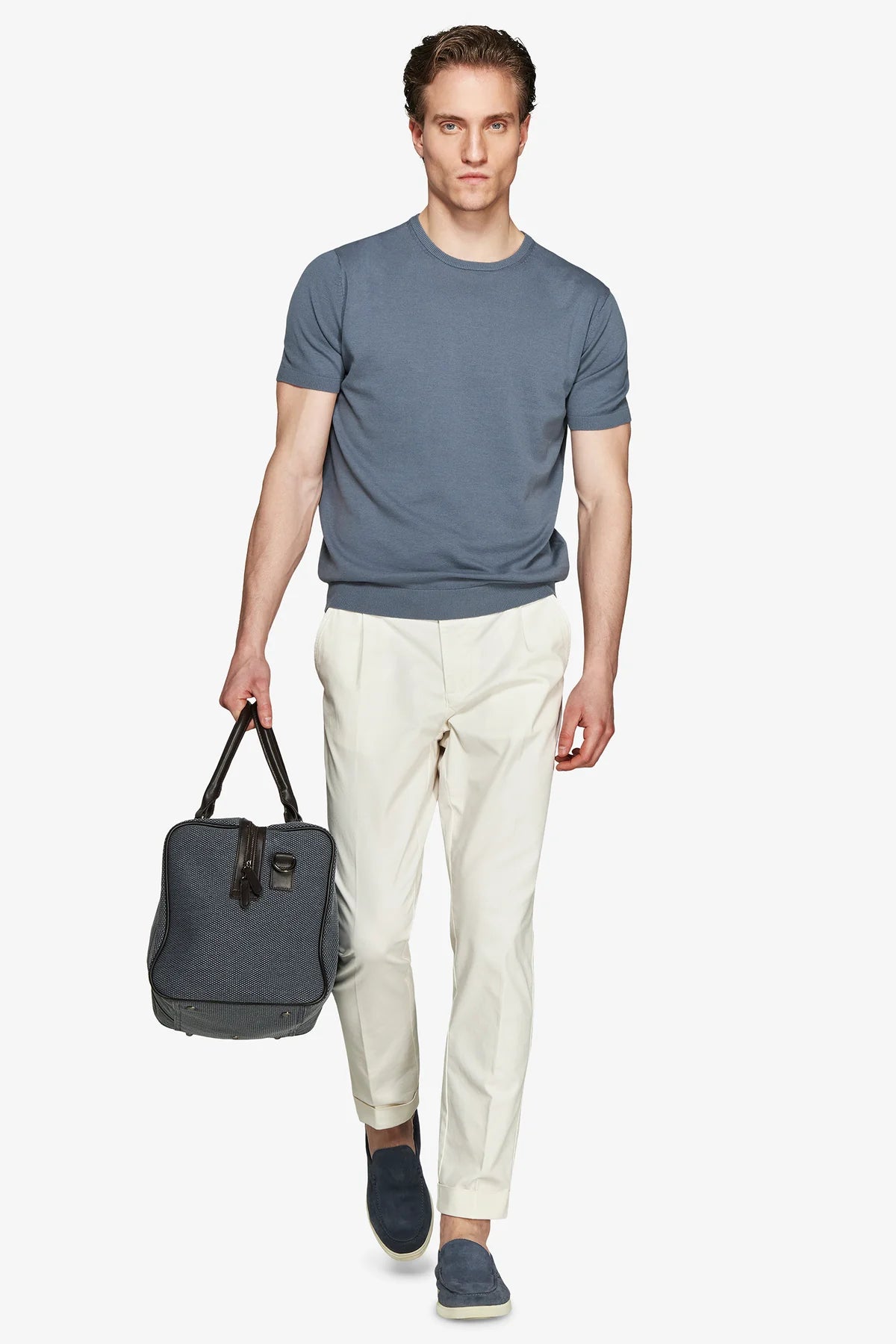 Slate blue fine-gauge knit short-sleeve crew neck shirt with ribbed cuffs and hem.