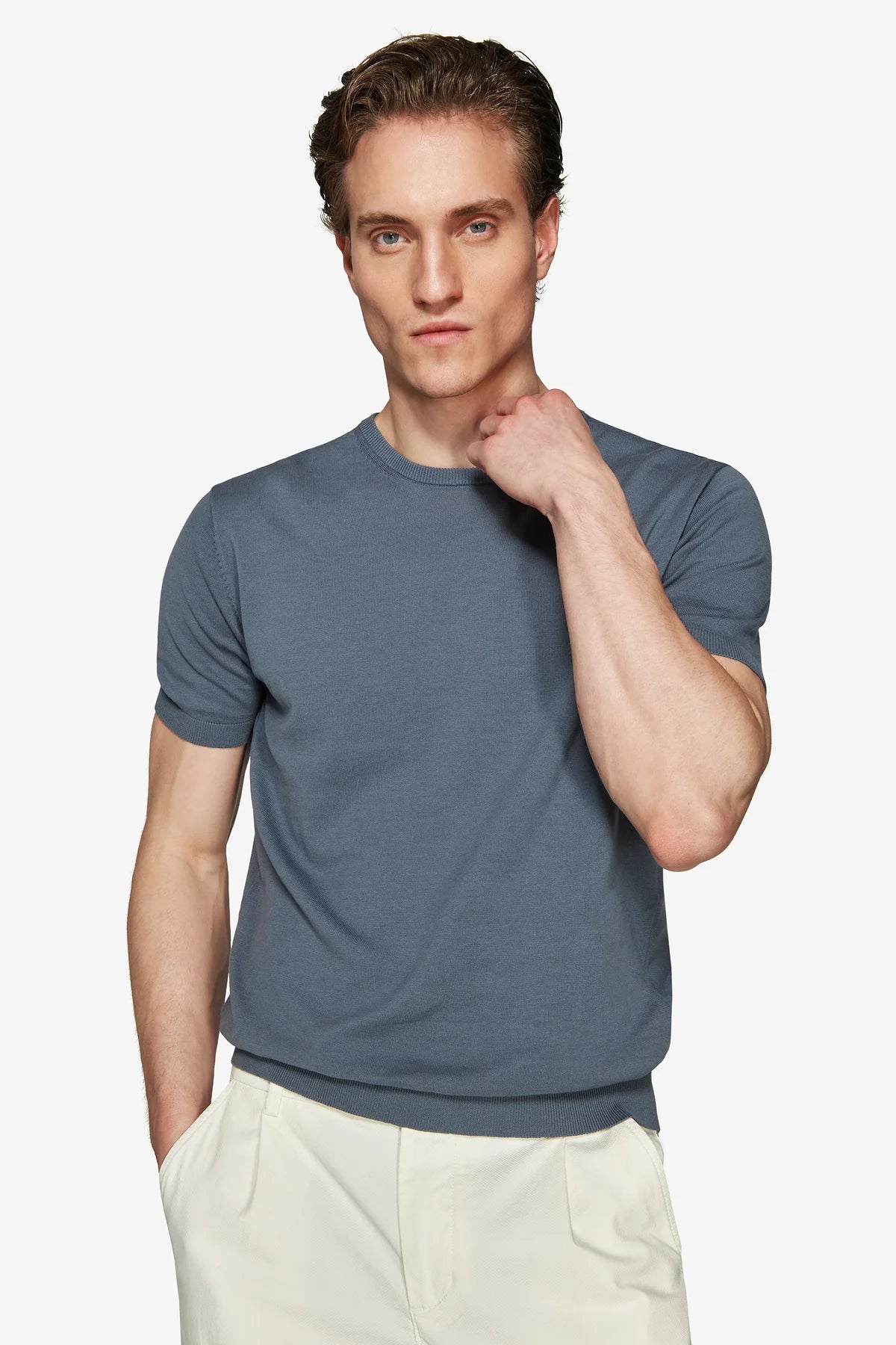 Blue-grey short-sleeve knit t-shirt with ribbed crew neck, sleeve cuffs, and hem.