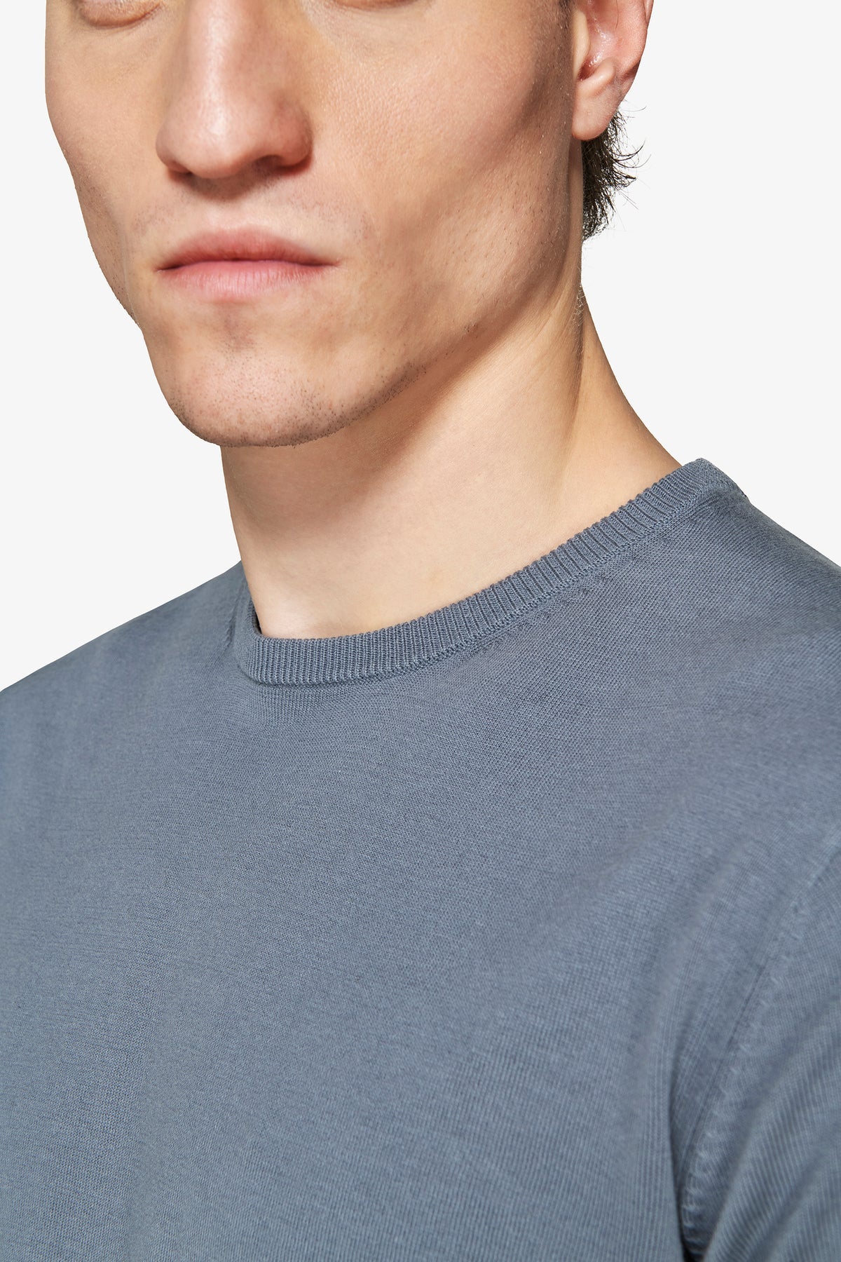Blue-grey fine knit short-sleeved top with a ribbed crew neck.