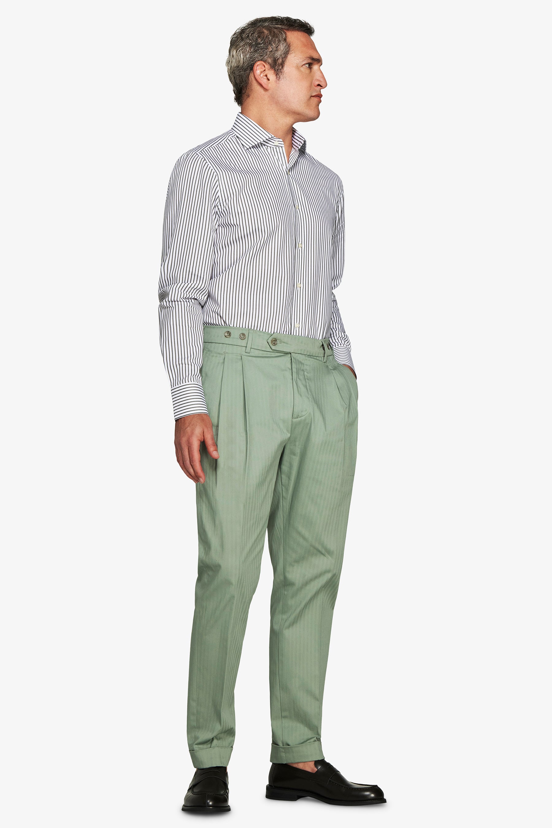 White long-sleeve button-up shirt with thin vertical dark stripes, a spread collar, and buttoned cuffs.