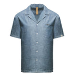 Light blue chambray short-sleeved shirt with revere collar, chest pocket, embroidered logo, and white buttons.