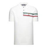 Off-white polo with two buttons and a pocket with green, grey, red stripes, a gold-toned emblem, and 'A.M. 1923'.