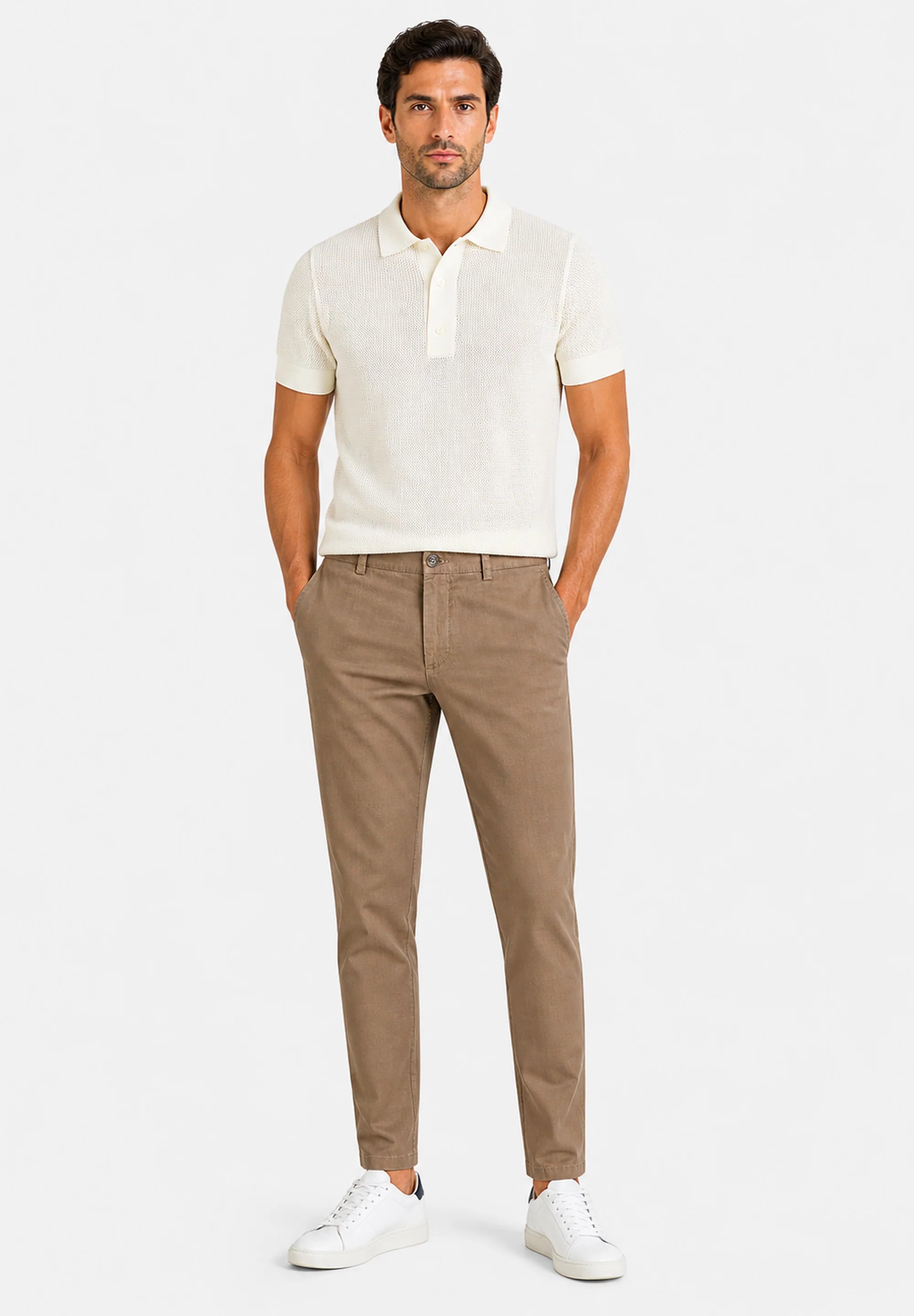 Sand-colored chino pants with a slim, tapered fit, gold-toned button closure, zipper fly, belt loops, and front slash pockets