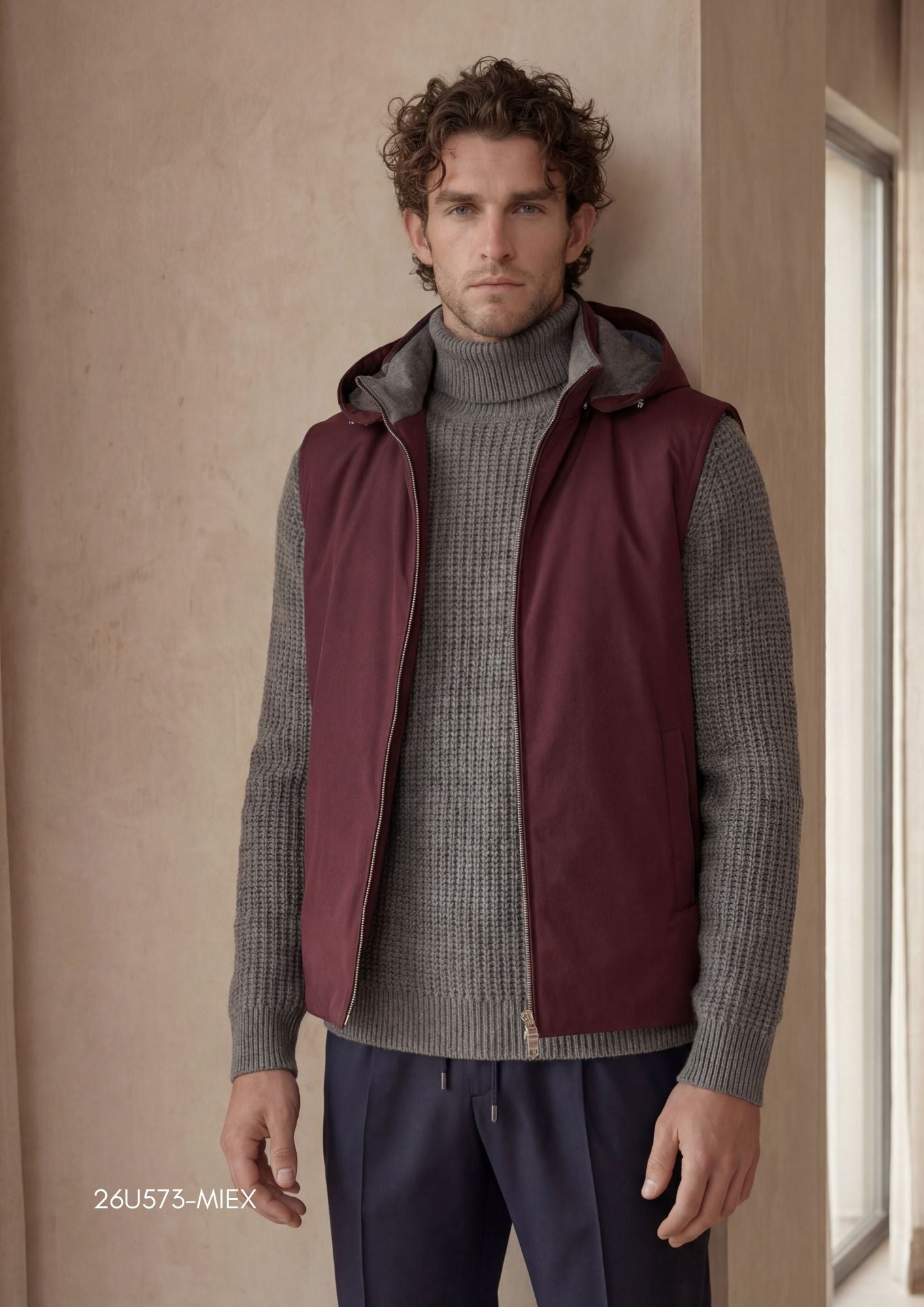 Bordeaux vest with a full-length silver-toned zipper, a grey-lined hood with drawstrings, and two front slit pockets.
