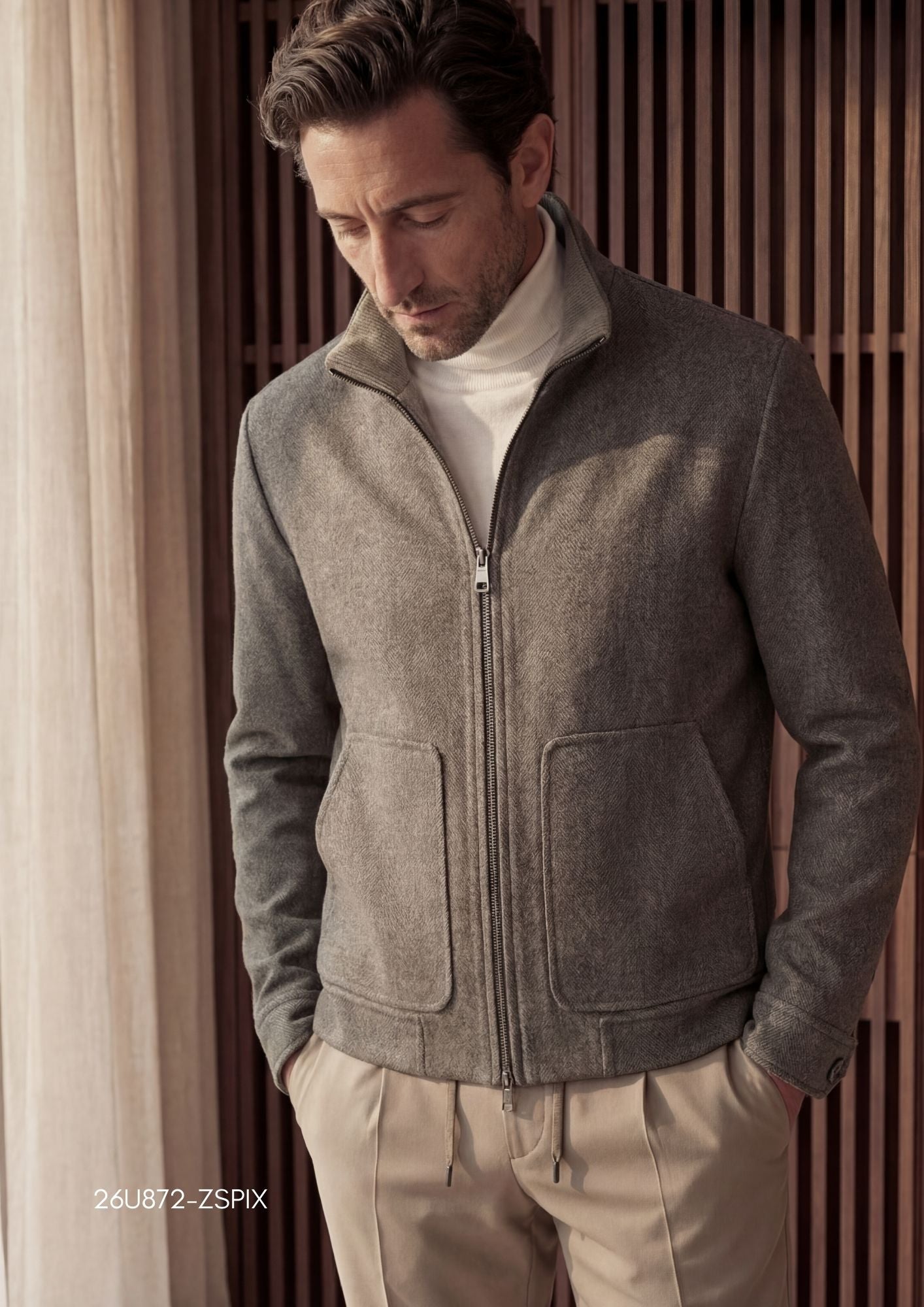 Heathered grey-brown full-zip jacket with a stand-up corduroy collar, two rounded patch pockets, and banded cuffs and hem.