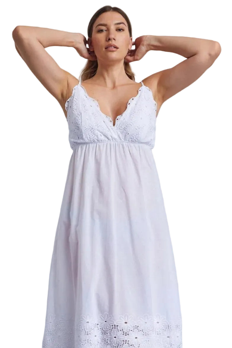 White voile chemise dress with scalloped V-neckline, eyelet lace bodice, gathered waist, and floral eyelet lace hem.