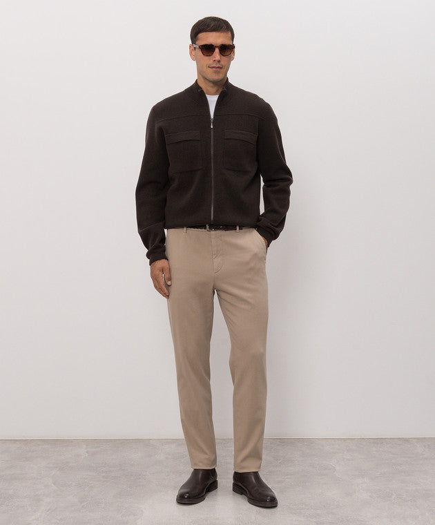 Dark burgundy red knit sweater with a stand-up collar, full silver-toned zip front, and two flap chest pockets.
