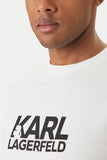 White crewneck t-shirt with black 'KARL LAGERFELD' logo, featuring a stylized 'A' with a head silhouette.