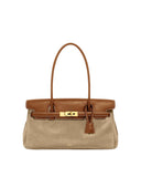 Two-toned bag: light brown suede body, dark brown leather flap. Gold-toned turn-lock closure, thin strap, white contrast stit