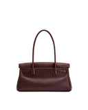Dark reddish-brown structured shoulder bag with a top flap, two slender shoulder straps, and two small loop details on the fr