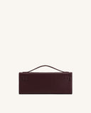 Structured rectangular dark red faux leather top handle handbag with two matching decorative buckle details on the front.