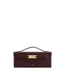 JW PEI Bria structured top handle handbag in deep claret with gold-toned buckle closure and embossed logo.