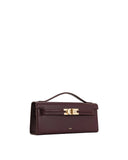 Structured burgundy faux leather top handle bag with a front flap, gold-toned turn-lock clasp, and thin top handle.
