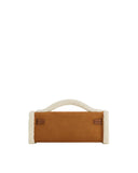 Brown faux suede structured top handbag with cream fluffy trim and handle. Two small brown straps with gold-toned buckles on