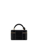Black crocodile-embossed box-shaped top handle bag with a single curved handle and two horizontal gold-toned zippers on the f