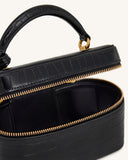 Black crocodile-embossed box-shaped top handle bag, partially open, with a single handle, gold-toned zipper, and black interi
