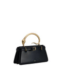 Black structured top handle bag with a gold-toned snake handle, green eyes, and a front strap with a gold-toned buckle.