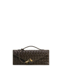 Dark brown woven textured envelope top handle bag with a gold-toned curved clasp and a thin strap.