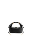 Black pebbled leather top-handle bag with two rounded handles, four gold-toned metal rings, and a strap with pointed gold-ton