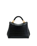Black crocodile-embossed top handle bag with a curved handle and gold-toned hardware.
