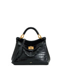 Black faux crocodile embossed top handle bag with a front flap, gold-toned clasp, and a shoulder strap.