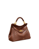 Brown faux leather top handle bag with a single curved handle, gold-toned hardware, and a front flap with a gold-toned turn-l