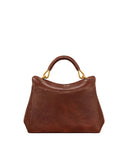 Brown faux leather top handle bag with a curved top. A single brown handle is attached by four gold-toned rings.