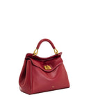 Deep red top handle bag with a smooth finish, featuring a curved handle, gold-toned hardware, and a rectangular turn-lock cla