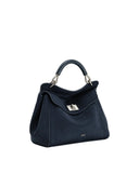 Navy blue faux suede top handle bag with a flap closure, silver-toned turn-lock, and a dark blue top handle. 'JW PEI' logo on
