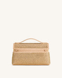 Champagne top handle bag with a structured rectangular shape, covered in small gold-toned studs. Features a single curved han