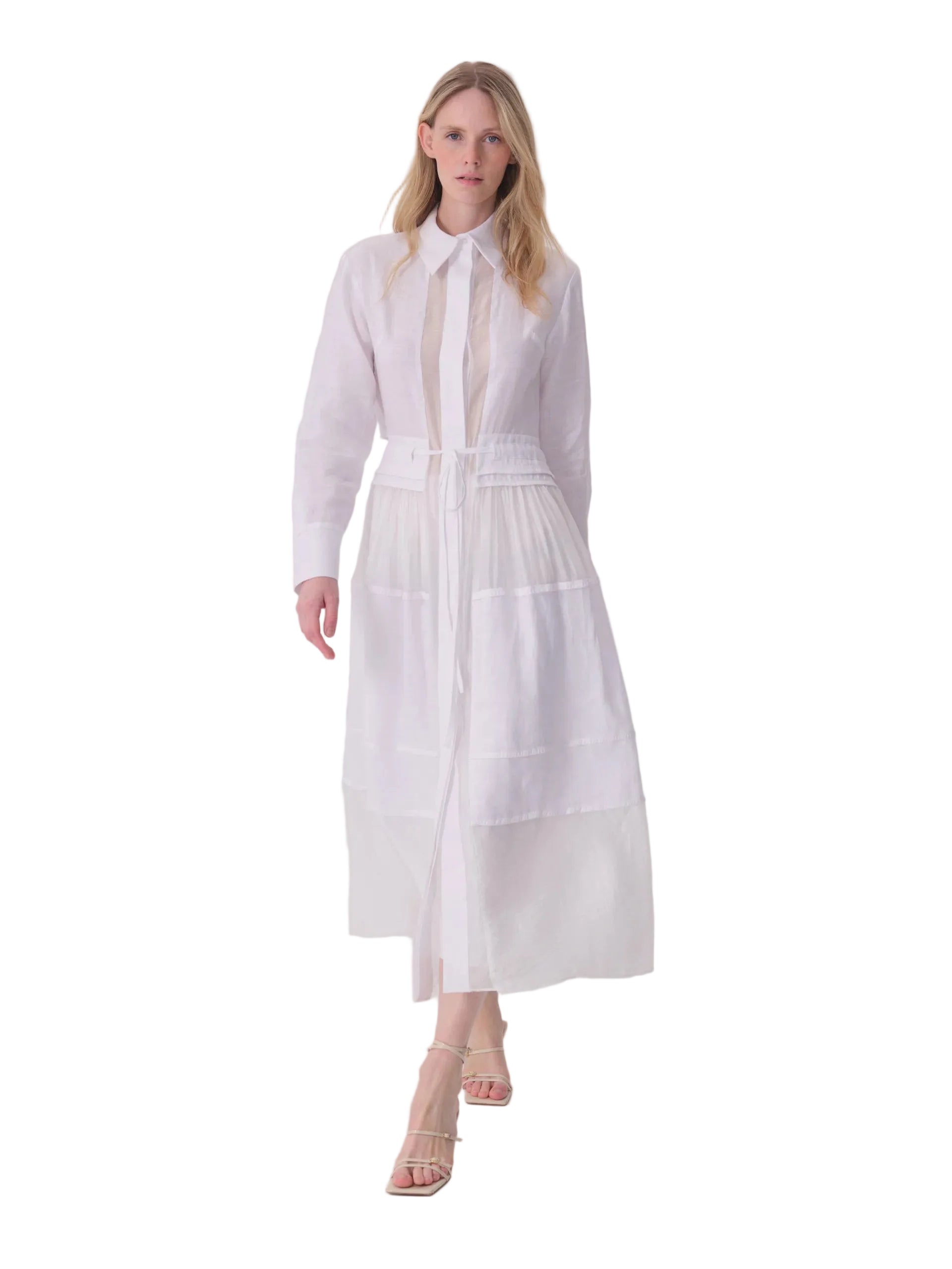 White long-sleeved collared shirt dress with a sheer central front panel, drawstring waist, and a long skirt with horizontal