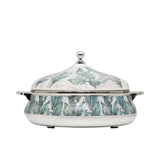 Casa Blu insulated serving casserole dish featuring a teal and white Lily of the Valley floral pattern with polished chrome handles and lid knob.