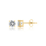 Pair of gold-toned stud earrings, each with a clear, round brilliant-cut stone in a four-prong setting.