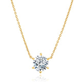 Yellow gold-toned cable chain necklace with a clear round faceted stone in a six-prong setting.
