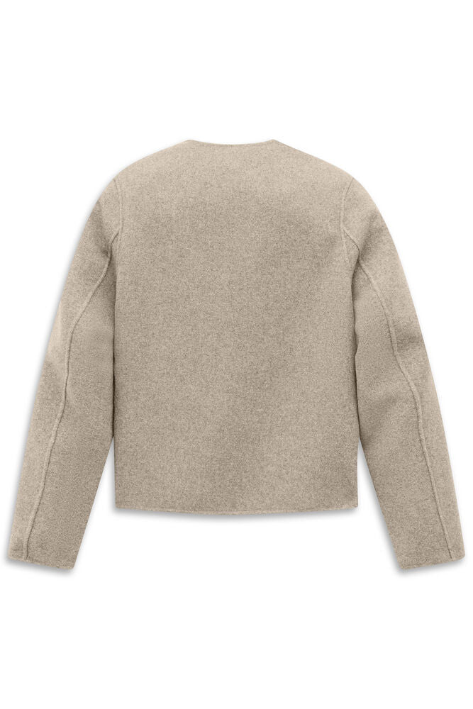 Beige collarless jacket with a textured finish, round neck, and visible seam details on the long sleeves.
