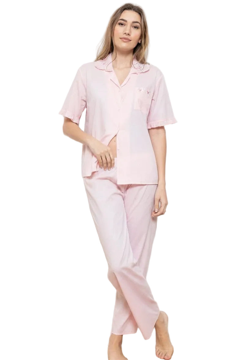 Light pink short-sleeved pyjama top with rose embroidery on collar and pocket, and matching long pyjama trousers.