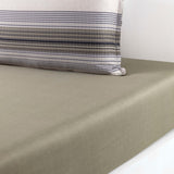 Muted olive green duvet cover and a pillowcase with horizontal stripes in off-white, navy, grey, and olive.
