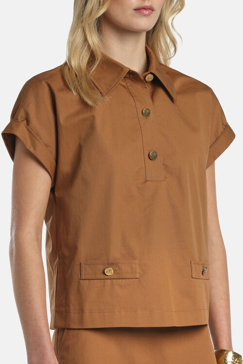 Tobacco short-sleeved shirt with a collar, three gold-toned buttons, and two flap pockets with gold-toned buttons.