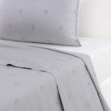 Light gray bedding set with dark gray pinstripes and scattered DoubleB monograms. Includes a white fitted sheet.
