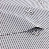 White fabric with thin black vertical stripes and repeated raised grey DoubleB logos.
