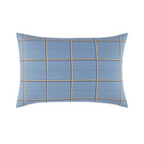 Light blue rectangular pillowcase with a windowpane grid pattern of thin white, black, and gold-toned stripes.