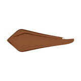Swatch of YSL All Hours Concealer in a medium brown shade, showing a smooth, creamy texture.