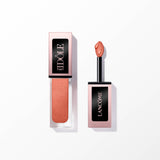 Lancome Idole Tint in a peachy-bronze shade, shown in a clear rectangular bottle with a rose gold-toned cap and a separate ap