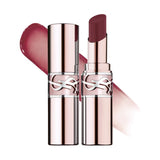 Two rose gold-toned lip balms. One closed, one open revealing a dark berry-red, glossy, angled balm stick. Both have a clear